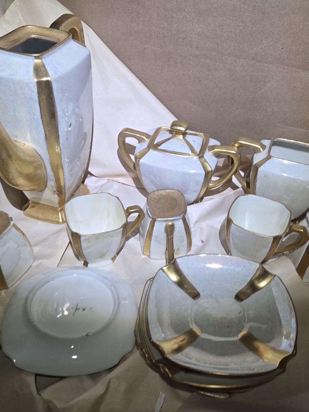 Elegant White Iridescent Tea Set with Gold Trim